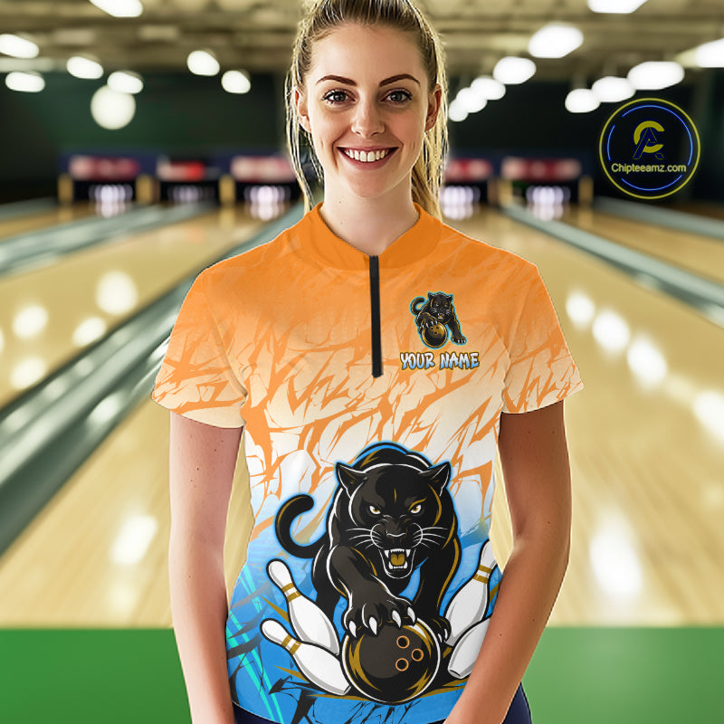 Bowler wearing custom orange and blue leopard bowling shirt on the lanes