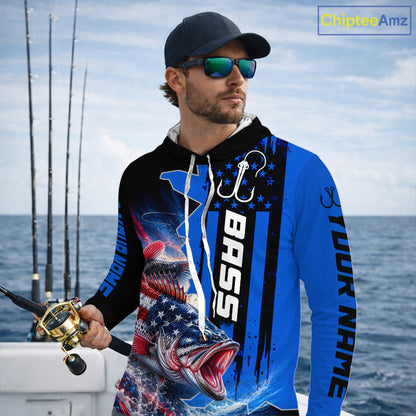 Angler wearing custom American flag bass patriotic blue camo long sleeve hooded fishing shirt on the water