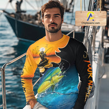 Load image into Gallery viewer, Man wearing a colorful mahi mahi fishing-themed shirt on a boat with water and another boat