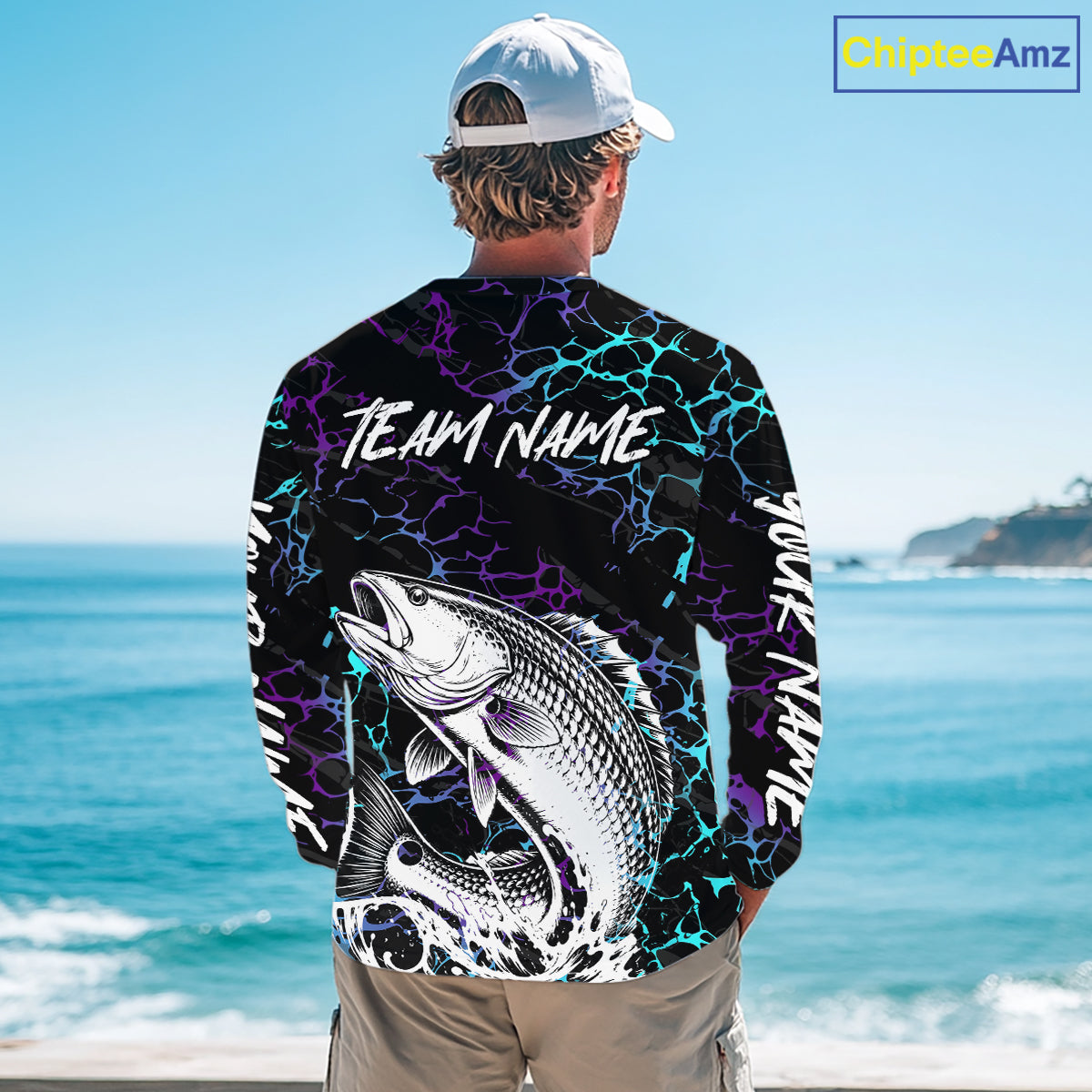 Angler wearing Redfish Fishing neon blue long sleeve saltwater fishing shirt on the boat with custom team name on the back