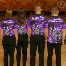 Load image into Gallery viewer, Back view of bowling team wearing matching purple tornado bowling shirts in a bowling alley.