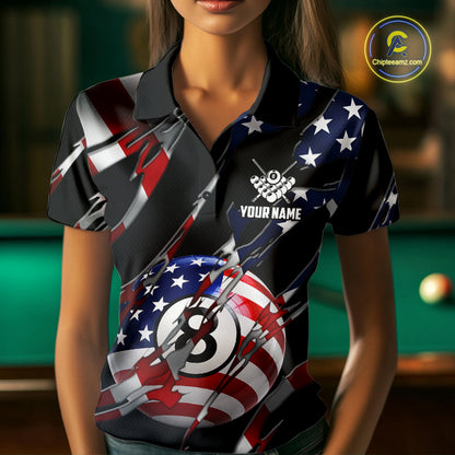 Woman wearing an American flag 8 ball pool billiard jersey beside a pool table front view.