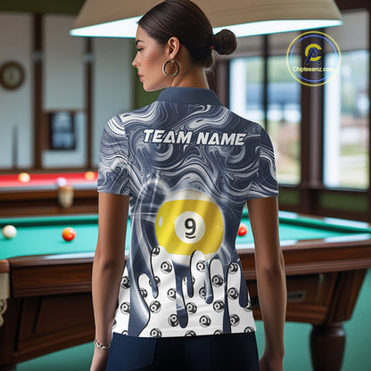 Back view of woman wearing a blue marble swirl 8 ball and 9 ball pool shirt in a billiards hall.