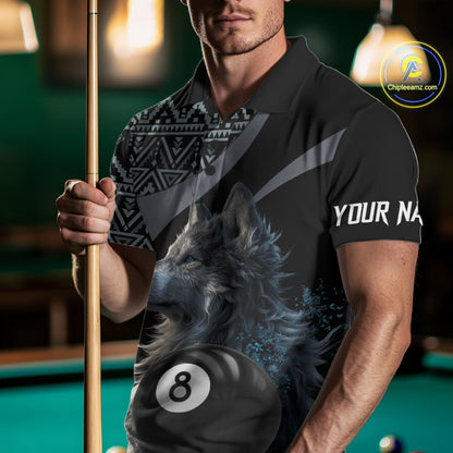 Man holding a pool cue with a shirt featuring a wolf design and number 8 on a pool table.