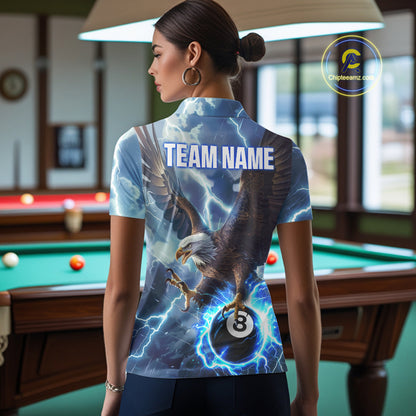 Back view of woman wearing a blue thunder eagle pool team shirt in a billiards hall.