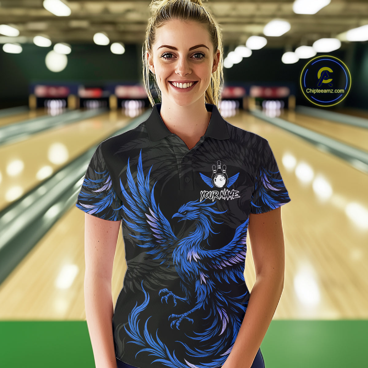 Woman wearing black and blue phoenix wings bowling polo shirt front view.
