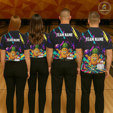Load image into Gallery viewer, Back view of bowling team wearing matching pineapple bowling shirts in a bowling alley.