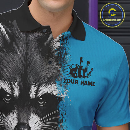 Close-up of a black and blue raccoon bowling polo shirt collar, buttons, and raccoon artwork details.