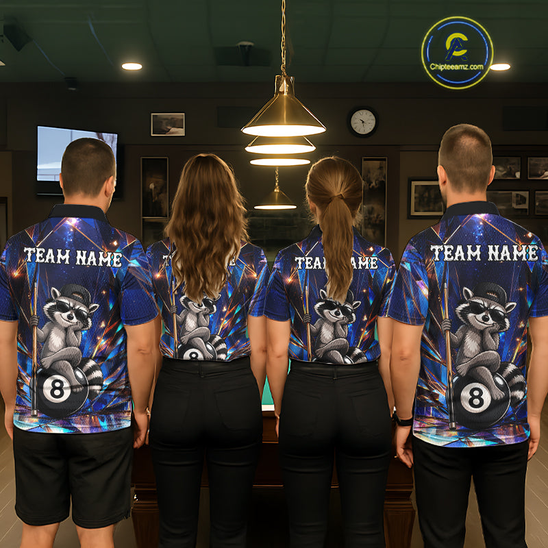 Back view of pool players wearing matching raccoon 8 ball billiard shirts in a game room.