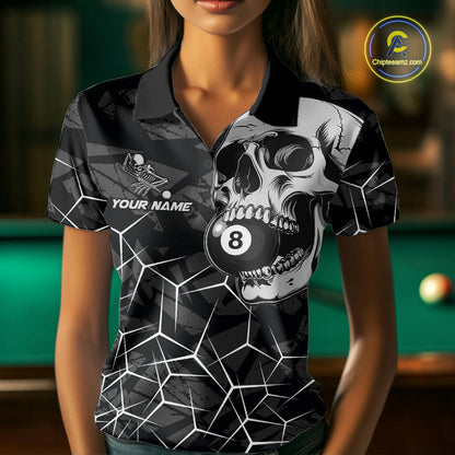 Woman wearing a black and white skull billiard jersey beside a pool table front view.