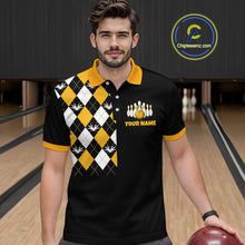 Load image into Gallery viewer, Man wearing a black bowling-themed shirt with a pattern and text in a bowling alley.