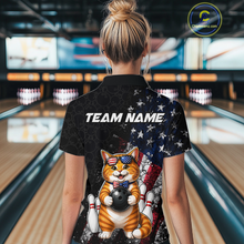 Load image into Gallery viewer, Women wearing a bowling shirt with a cat american flag design and 'TEAM NAME' text in a bowling alley.