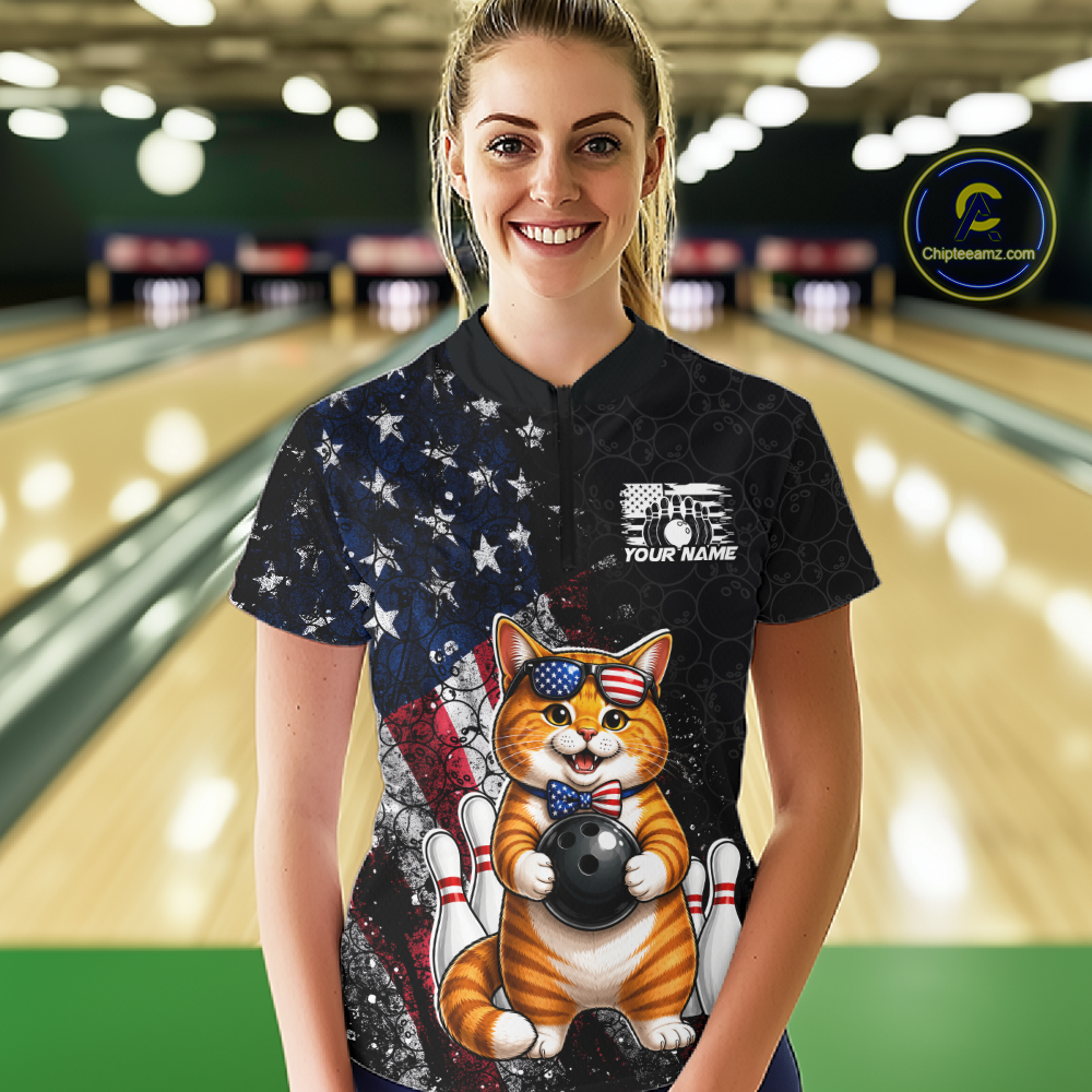 Women wearing a black bowling shirt with a cat american flag design in a bowling alley
